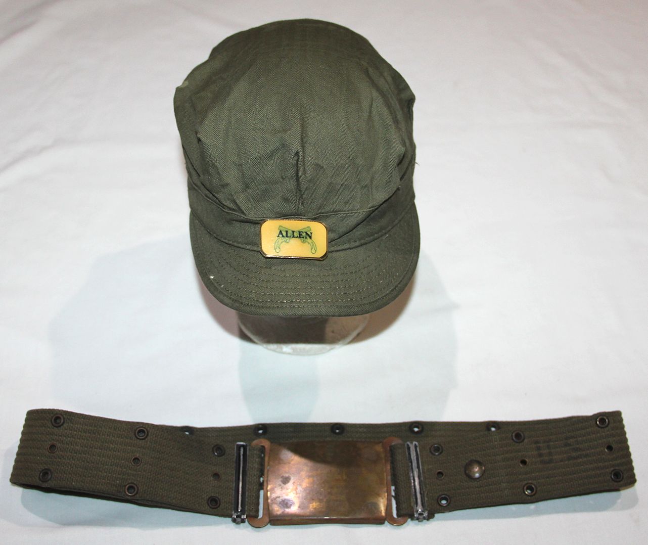 D114. NAMED WWII MILITARY POLICE BELT AND 1944 HBT CAP B & B Militaria